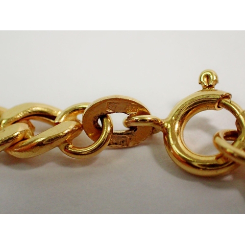 402 - An 18 carat gold charm bracelet, 11g with three 18 carat gold charms, 18cm long