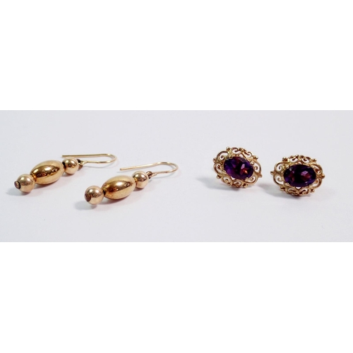 409 - A pair of 9 carat gold and amethyst earrings, 1.5g and a yellow metal pair unmarked