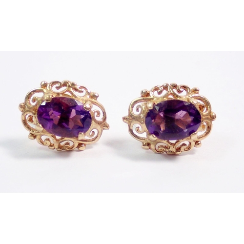 409 - A pair of 9 carat gold and amethyst earrings, 1.5g and a yellow metal pair unmarked