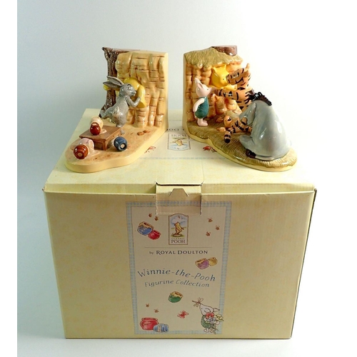 41 - A pair of Royal Doulton Winnie the Pooh bookends 'Push Pull' boxed, 11.5cm tall