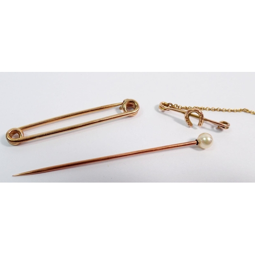 410 - A gold and pearl Cintra stick pin - cased, 1.1g and a 9 carat gold Good Luck horseshoe stick pin, 1g... 