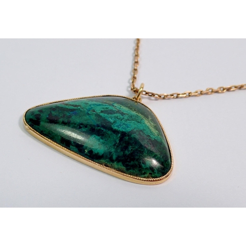 416 - A yellow metal and malachite pendant (tested as gold) on yellow metal chain (unmarked and untested)