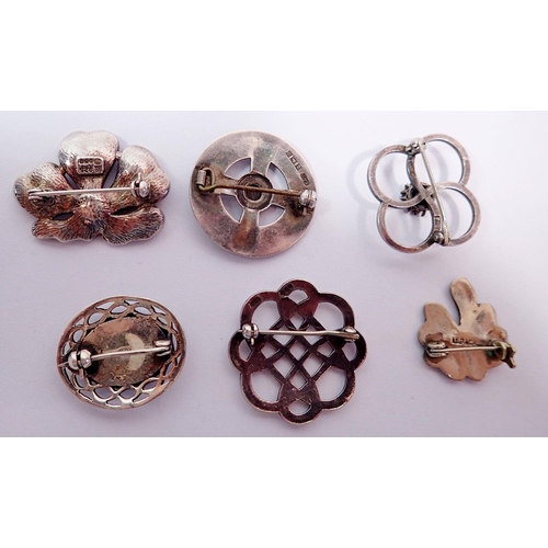 435 - Six various silver brooches including Celtic, shell and enamel