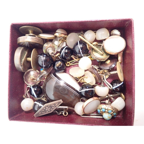 447 - A box of military buttons, French bullet brooch, agate studs etc