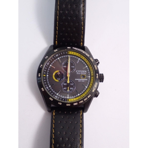 462 - A Citizen Eco-Drive chronograph WR 100 gentlemans watch in black case with yellow detailing and a bl... 