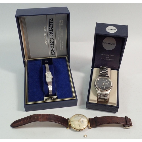 487 - A Sekonda stainless steel watch with black dial - boxed, a vintage Roamer watch and a Seiko ladies w... 