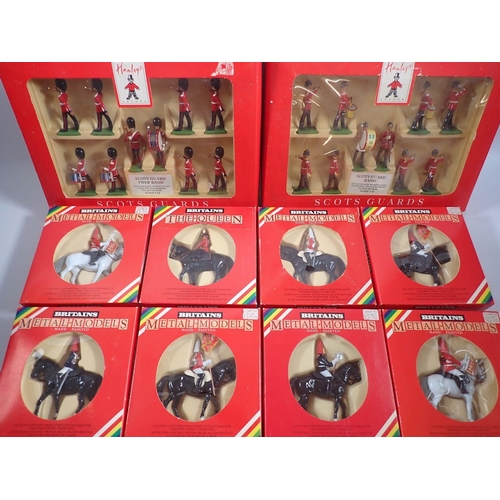 490 - A box of fourteen Britains metal models including Scots Guard Band and Piper Band for Hamleys plus 7... 