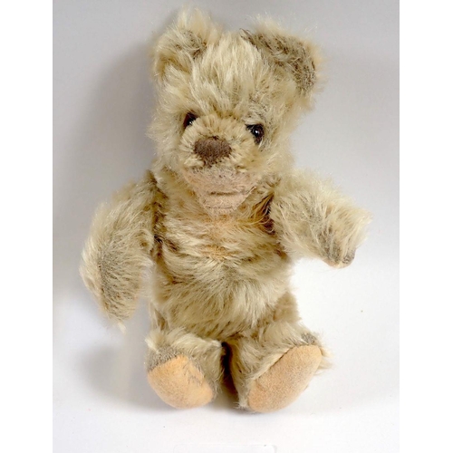 518 - A 1950's Steiff Baby Zotty bear with button and repaired mouth, 16cm tall