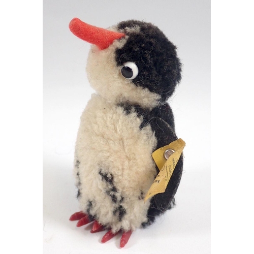 519 - A 1973 Steiff Woolen Penguin chick, limited edition tag No 7390/10 and button, 9cm tall