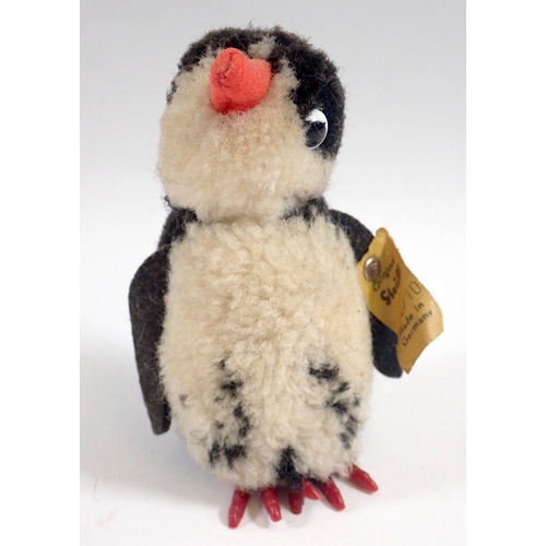 519 - A 1973 Steiff Woolen Penguin chick, limited edition tag No 7390/10 and button, 9cm tall