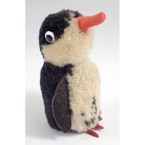 519 - A 1973 Steiff Woolen Penguin chick, limited edition tag No 7390/10 and button, 9cm tall