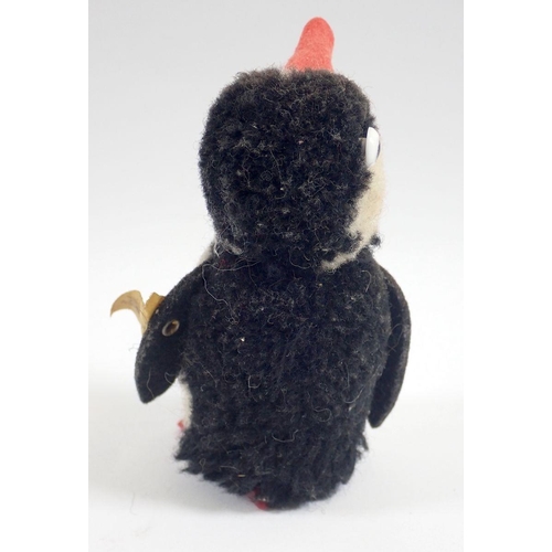 519 - A 1973 Steiff Woolen Penguin chick, limited edition tag No 7390/10 and button, 9cm tall