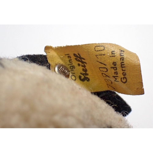 519 - A 1973 Steiff Woolen Penguin chick, limited edition tag No 7390/10 and button, 9cm tall