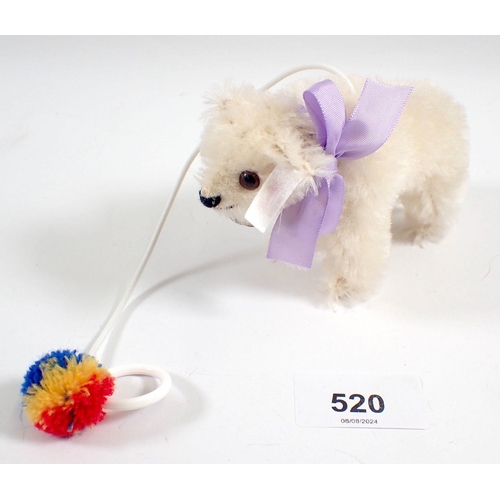 520 - A Steiff small polar bear cub toy, 2006 7.5cm, with bell and pompom, 10cm long