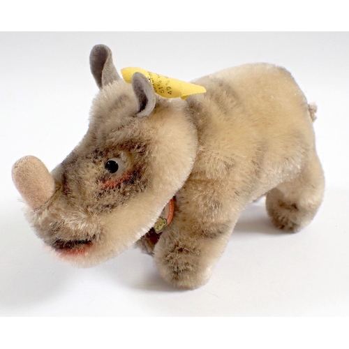 521 - A 1959 Steiff Nosy Rhinoceros tag No 1310.00 and button, 13cm long