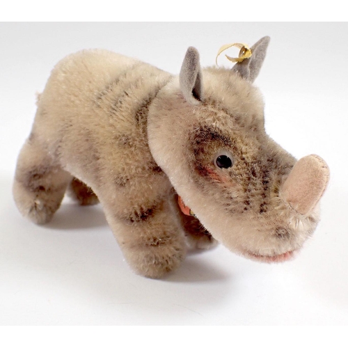 521 - A 1959 Steiff Nosy Rhinoceros tag No 1310.00 and button, 13cm long