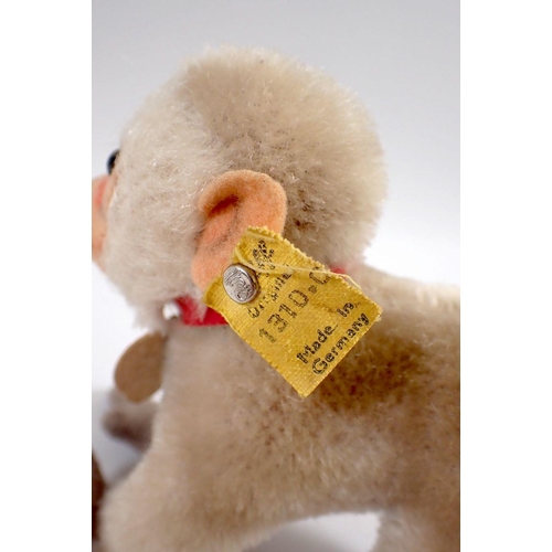 527 - A 1950's Steiff mohair Coco baboon monkey, tag No 1310.0 and button, 10cm tall