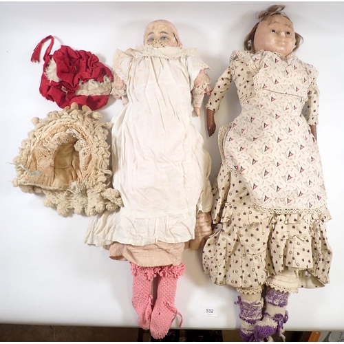 532 - Two Victorian wax headed dolls - in poor condition, with fabric bodies and original clothing, approx... 