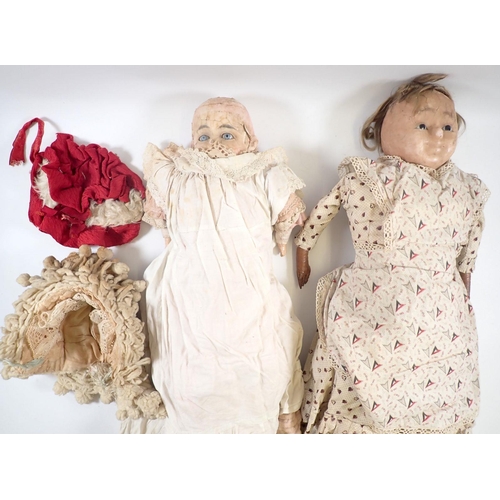 532 - Two Victorian wax headed dolls - in poor condition, with fabric bodies and original clothing, approx... 