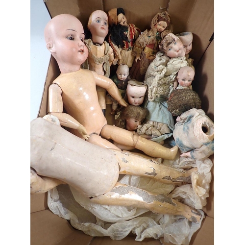 534 - A box of antique doll parts and dolls including Armand Marseille 390, dolls heads etc.