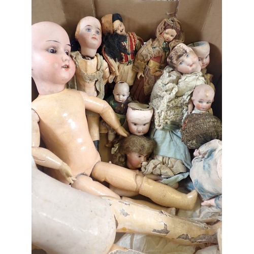 534 - A box of antique doll parts and dolls including Armand Marseille 390, dolls heads etc.