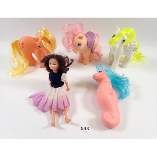 543 - Four vintage 'My Little Pony' ponies including a seahorse example and a Hornby Flower Fairy doll