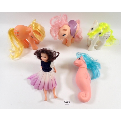 543 - Four vintage 'My Little Pony' ponies including a seahorse example and a Hornby Flower Fairy doll