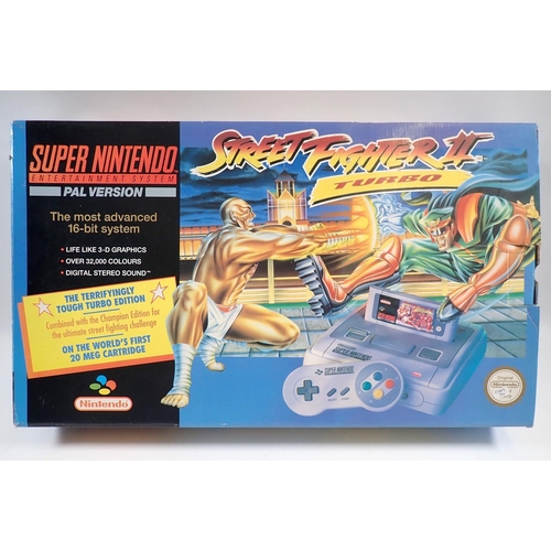 544 - A Super Nintendo Entertainment system (SNES) console containing Street Fighter II Turbo complete wit... 