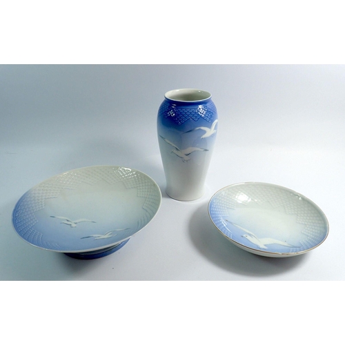 57 - A Copenhagen vase, 21.5cm tall and two bowls painted seagulls