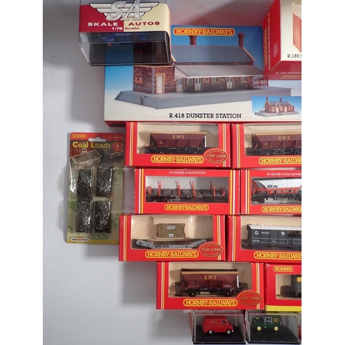 581 - A box of Hornby 00 gauge wagons and accessories including R6077 GWR 20 ton brake van, R6050 EWS HEA ... 