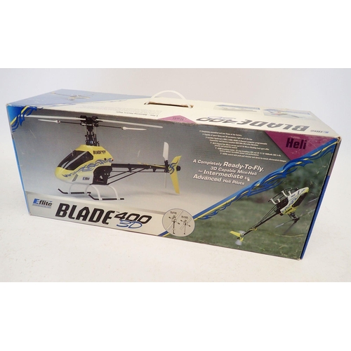 590 - A Blade 400 3D remote control helicopter includes battery pack and charger - boxed