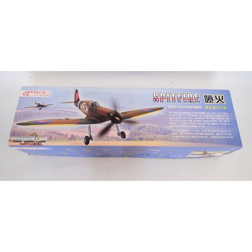 593 - An Art Tech remote control Spitfire aeroplane - boxed, wingspan 88cm