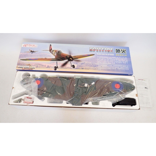 593 - An Art Tech remote control Spitfire aeroplane - boxed, wingspan 88cm