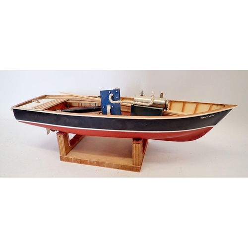 598 - An Oyster Catcher steam powered model boat, part built on stand, 77cm long