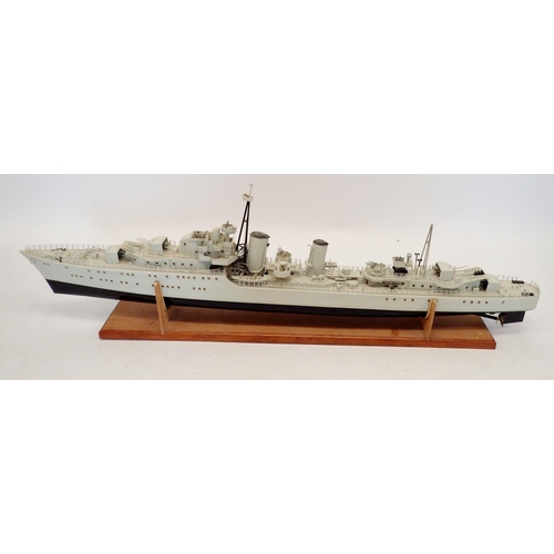 606 - A remote control model warship on wooden stand, no remote, approx 120cm long