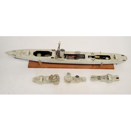 606 - A remote control model warship on wooden stand, no remote, approx 120cm long