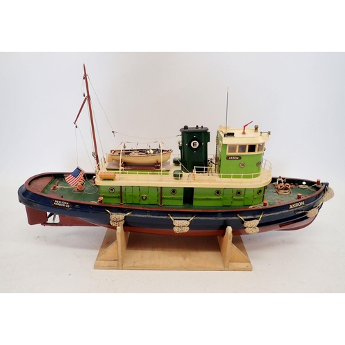 607 - A remote control model of the Akron tug boat, New York Harbour Co USA on stand, no remote, approx 96... 