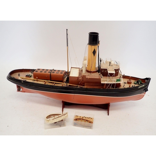 608 - A Jaffre steam tug boat fibreglass model on stand, part built, approx 76cm long