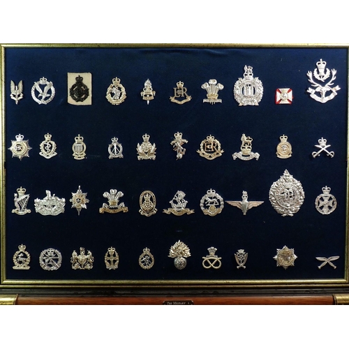 699 - Two framed displays of eighty Stay Bright military cap badges (please note - some badges may be re-s... 