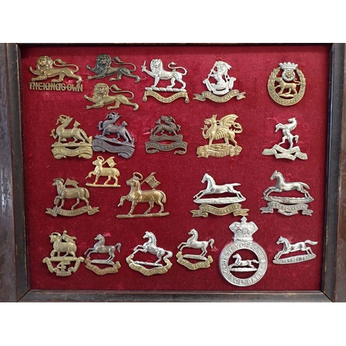 706 - A framed display of twelve tank corp and armoured corp military cap badges plus a framed display of ... 