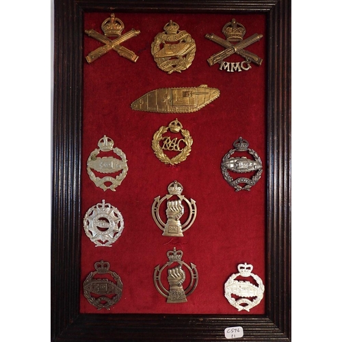 706 - A framed display of twelve tank corp and armoured corp military cap badges plus a framed display of ... 