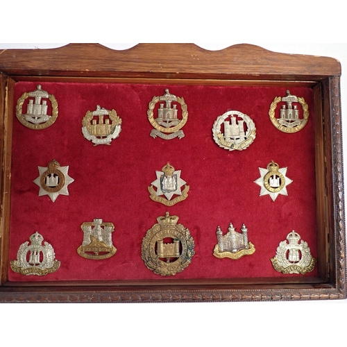 707 - A framed display of forty eight military cap badges including Military Police, Army Ordanance etc. a... 