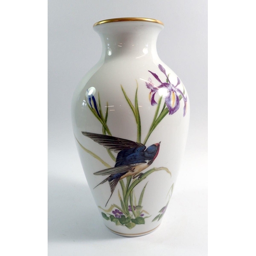 71 - A Franklin Mint porcelain vase decorated birds and flowers, 30cm