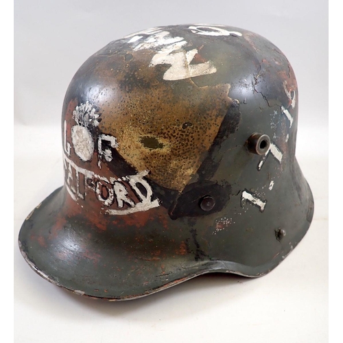 717 - A First World War German helmet painted 'Salford Battalion, 1.7.16'