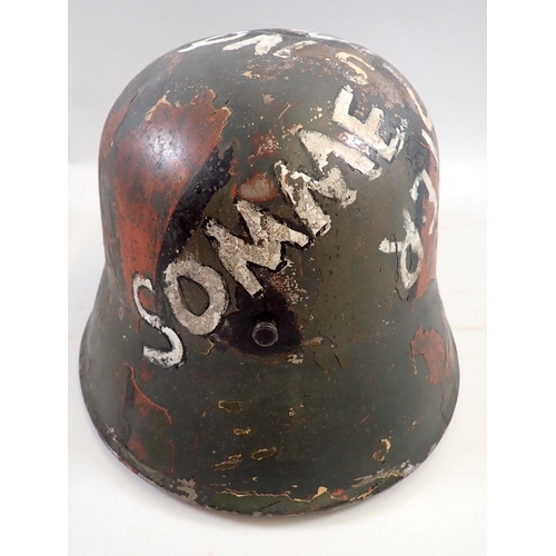 717 - A First World War German helmet painted 'Salford Battalion, 1.7.16'