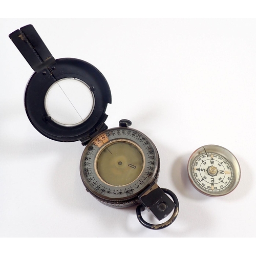 722 - A military issue compass with arrow mark and another compass