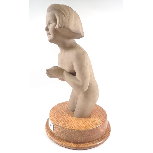 730 - An early 20th century composition three quarter statue of a girl praying, on circular oak base, 37cm... 