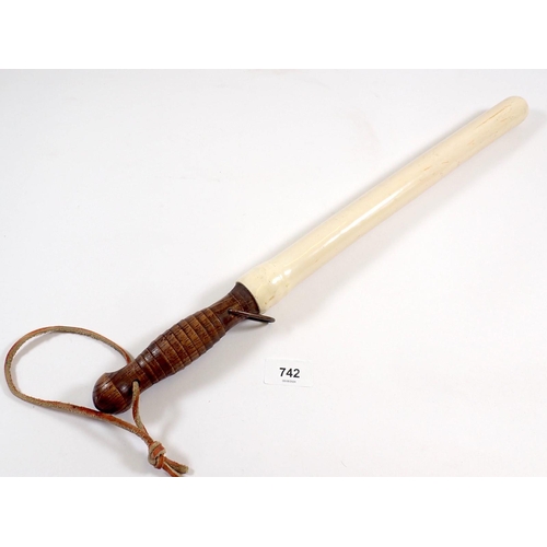 742 - A cermonial turned wood truncheon with white casing, 50cm