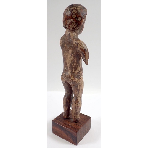 764 - A continental carved wood figure of a boy, 19cm tall