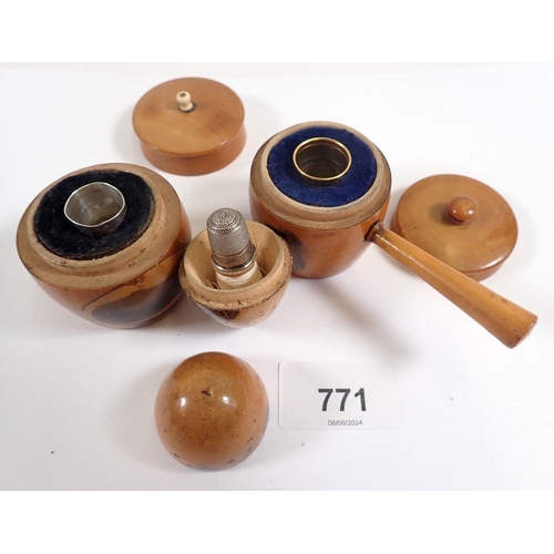 771 - A collection of mauchline ware including egg form etui, thimble case, acorn etc.